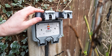 Photo of an outdoor 3 pin socket